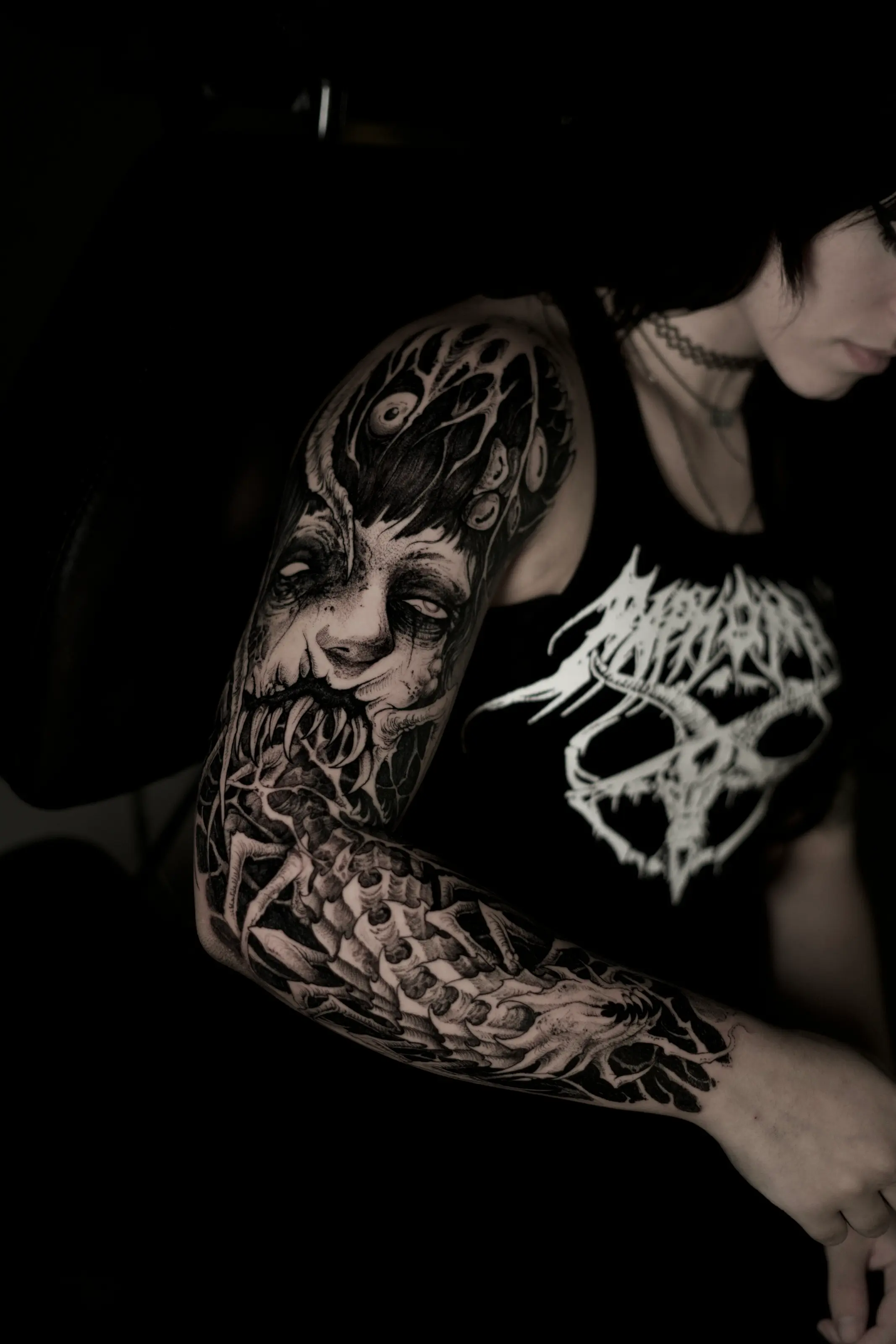 Dark surreal blackwork sleeve tattoo